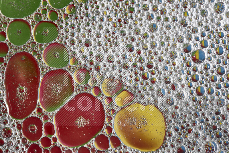 Close-ups of abstract soap bubbles and water droplets on multicolored background