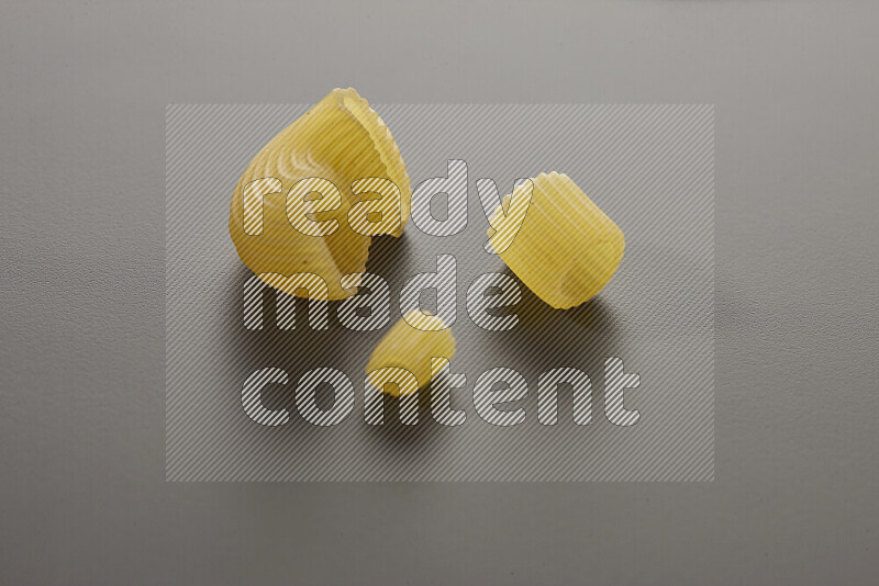 Different pasta types on grey background