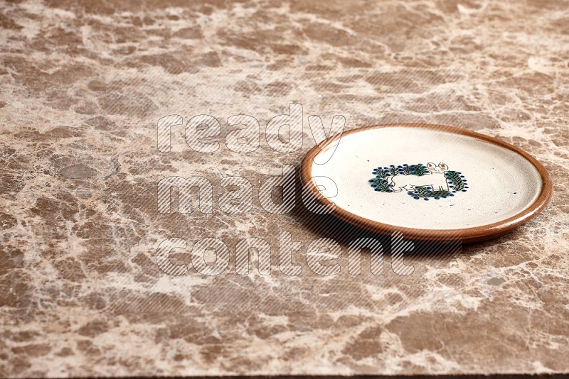 Decorative Pottery Plate on Beige Marble Flooring