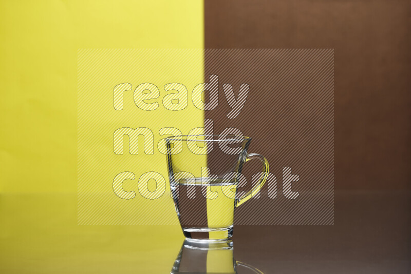 The image features a clear glassware filled with water, set against yellow and brown background