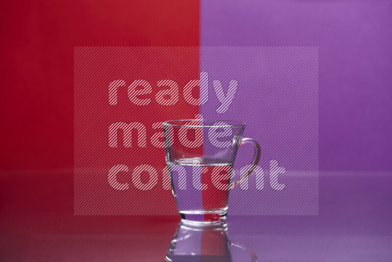 The image features a clear glassware filled with water, set against red and purple background