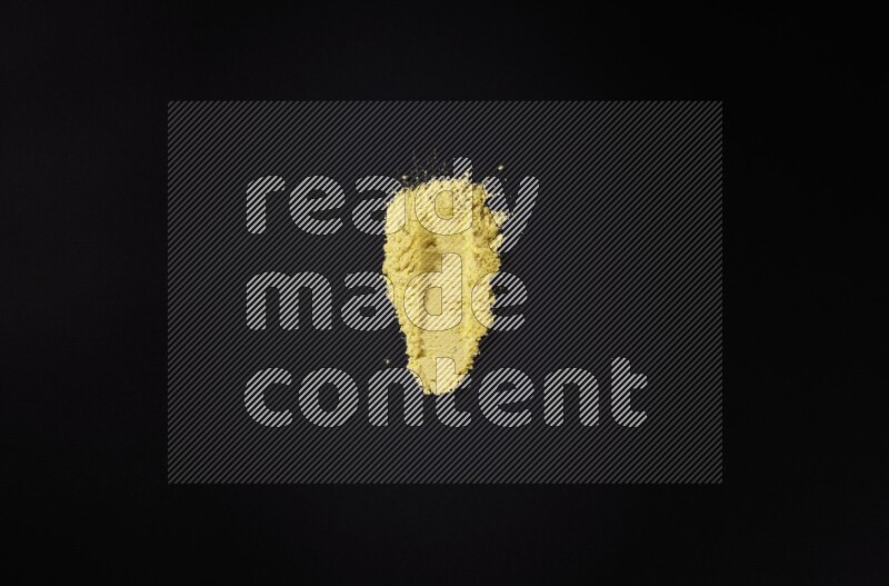 Yellow powder strokes on black background