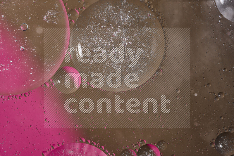 Close-ups of abstract oil bubbles on water surface in shades of pink and brown