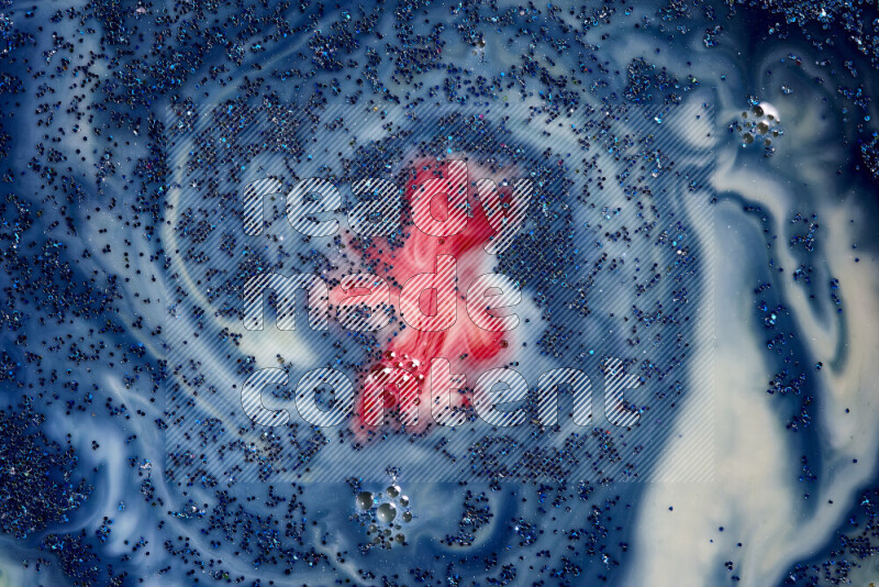 لقطة مقربة لبريق أزرق متلألئ منتشر على خلفية من اللون الأزرق والأحمر في حركات دائرية