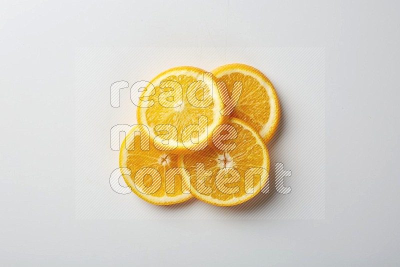 Four orange slices on a white background