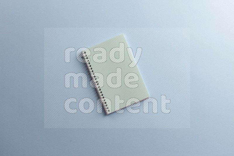 A blue notebook on blue background (Back to school)