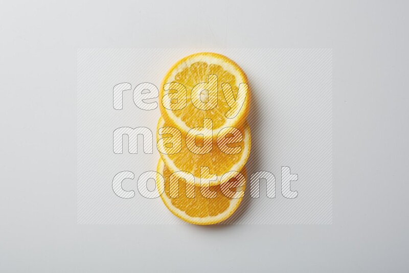 Three orange slices on a white background