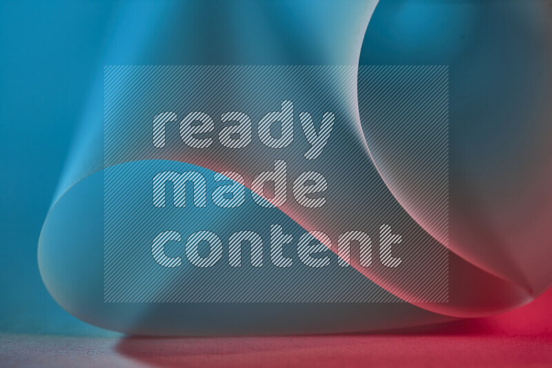 An abstract art piece displaying smooth curves in blue and red gradients created by colored light