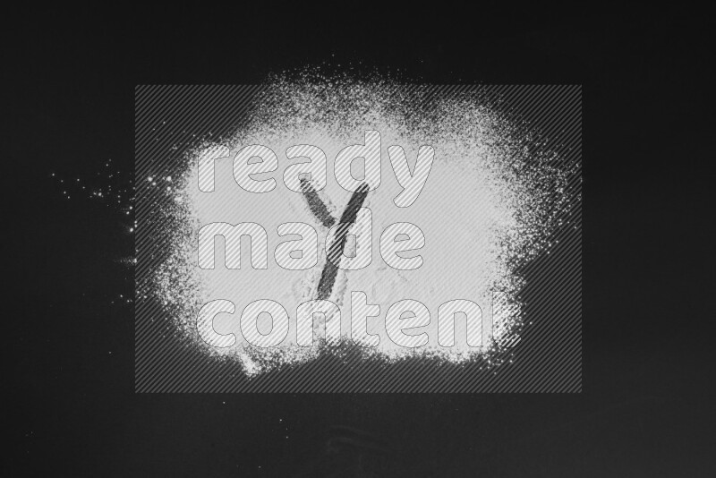 Alphabets written with powder on black background