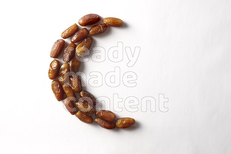 Dates in a crescent shape on white background