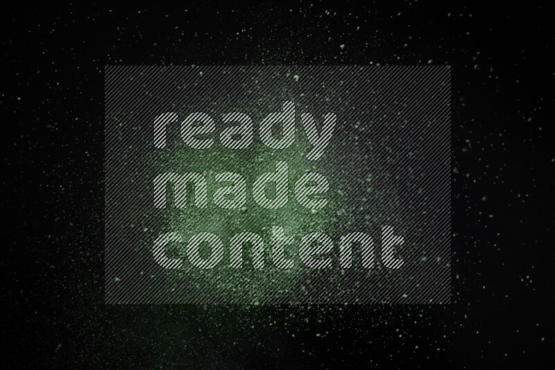 Green powder explosion on black background