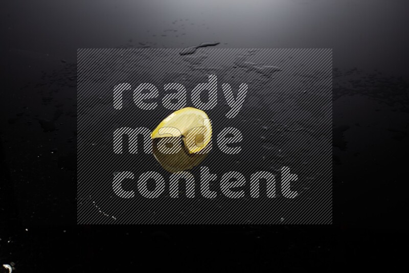 Lemon slice on black background