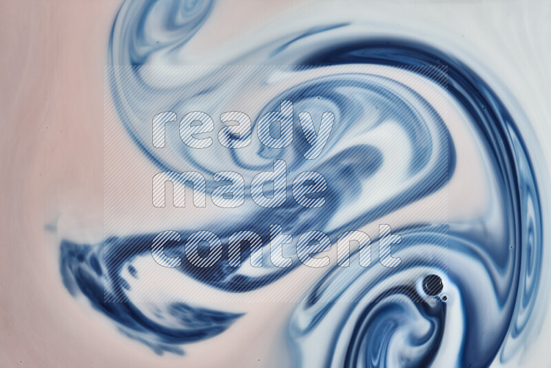 A close-up of abstract swirling patterns in blue, red and white