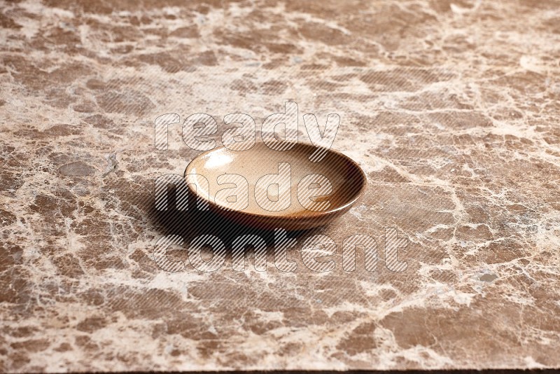 Beige Pottery Plate on Beige Marble Flooring, 45 degrees