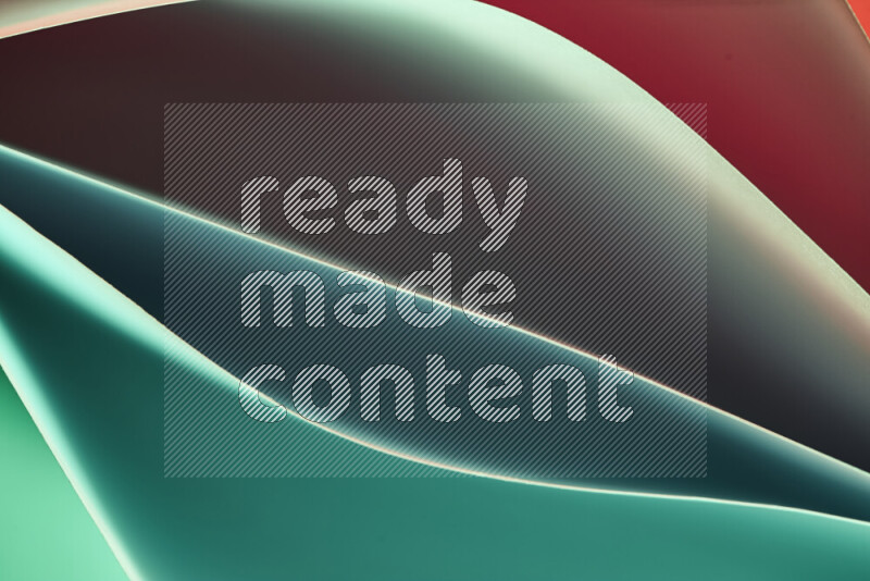 This image showcases an abstract paper art composition with paper curves in green and red gradients created by colored light