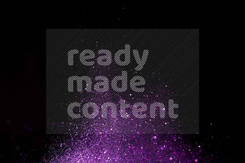 Purple glitter powder isolated on black background