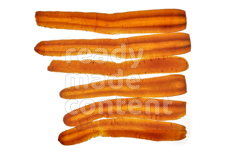 Carrots slices on illuminated white background