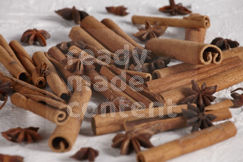 cinnamon sticks with star anise on white background