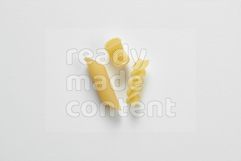 Different pasta types on white background