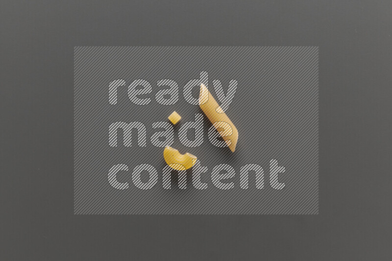 Different pasta types on grey background