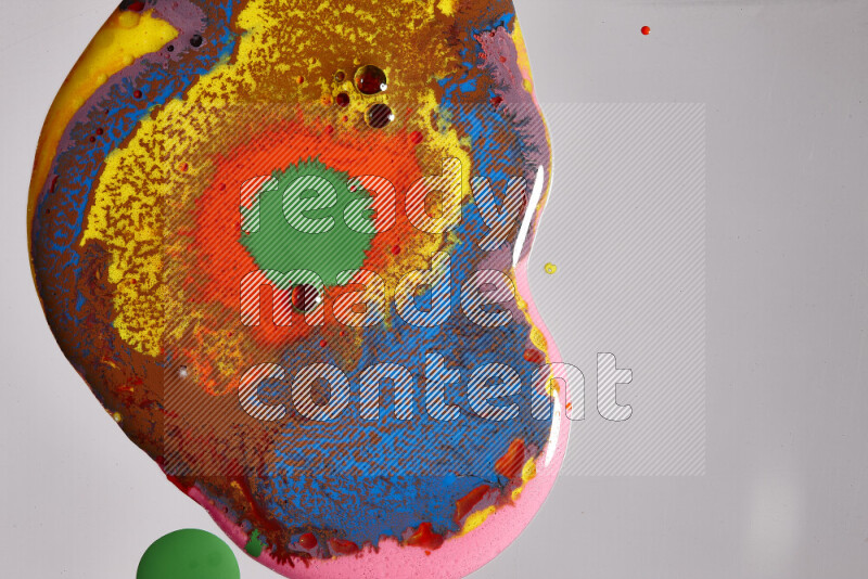 Close-ups of assorted colors blending on a grey background