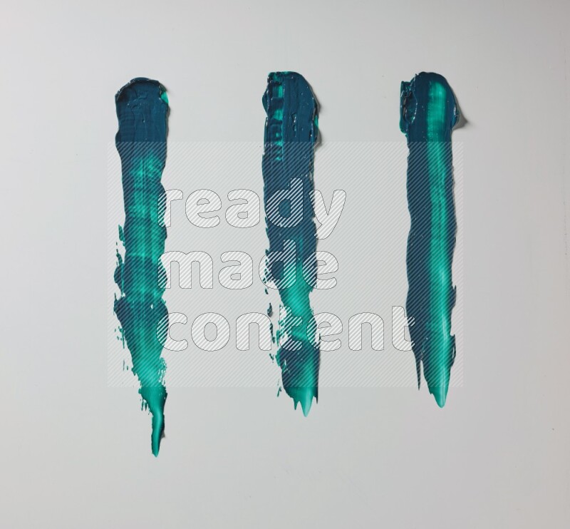 Turquoise painting knife strokes on white background
