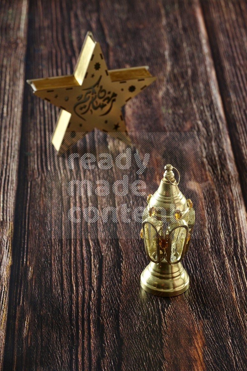 A star lantern with classic lantern on brown wooden background
