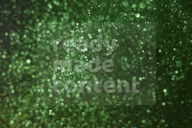 Green glitter powder isolated on black background