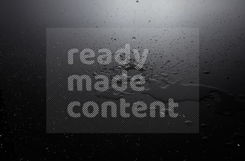 water drops, and droplets on black background