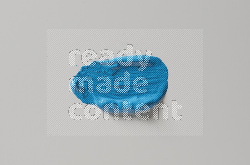 A single blue straight line brush stroke on a white background