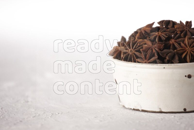 Star Anise in a white bowl on white background