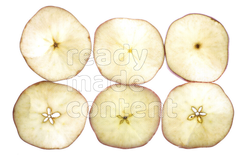 Apple slices on illuminated white background