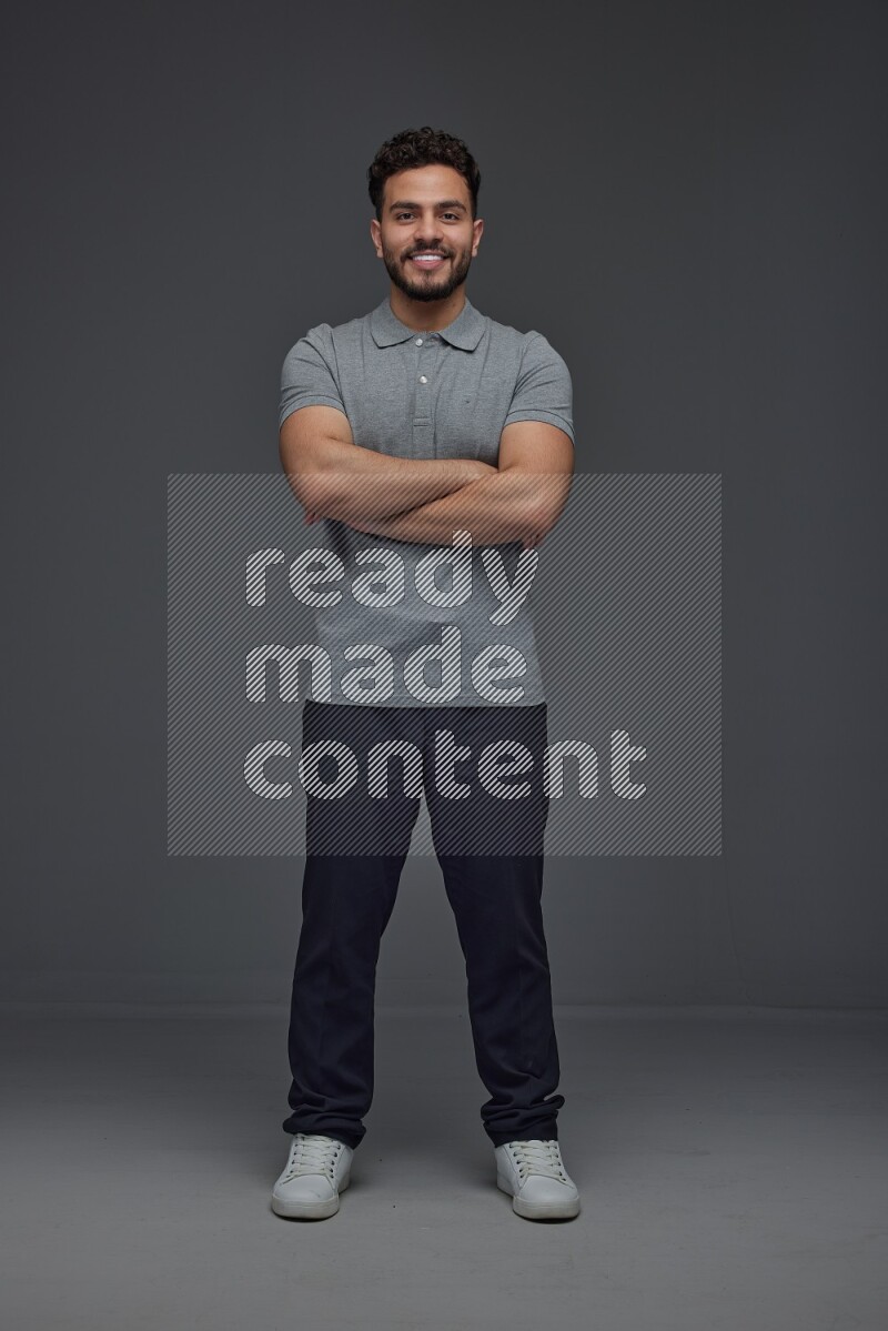 A man wearing casual making multi stand poses  eye level on a gray background
