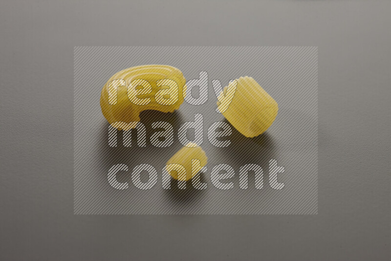 Different pasta types on grey background