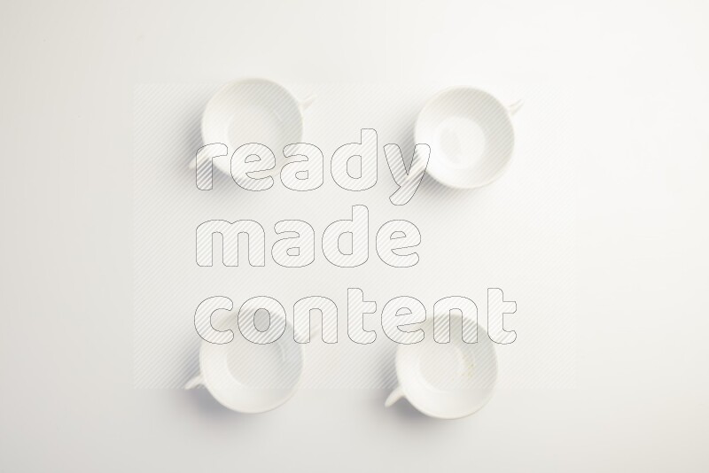 white ceramic round sauce dish on white countertop
