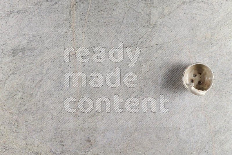 Top View Shot Of A Pottery Soap Dish On Grey Marble Flooring