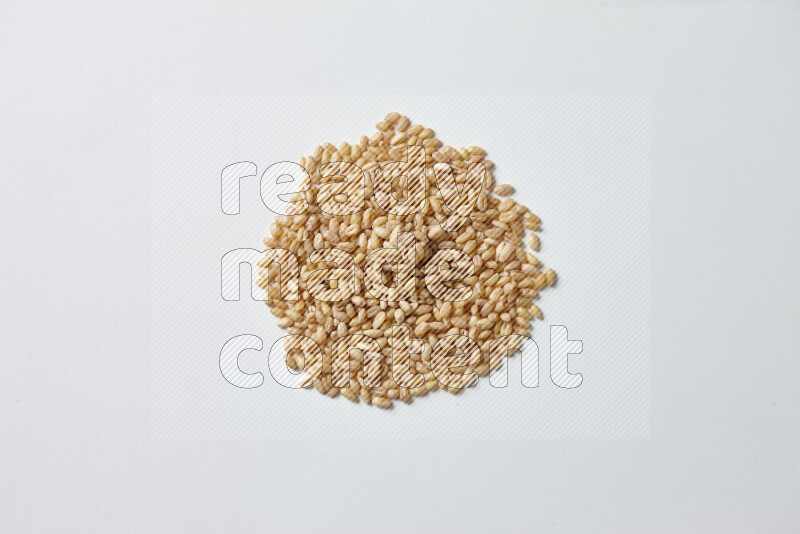 Hulled wheat on white background