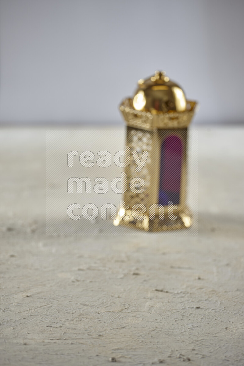 A lantern placed on a textured white background