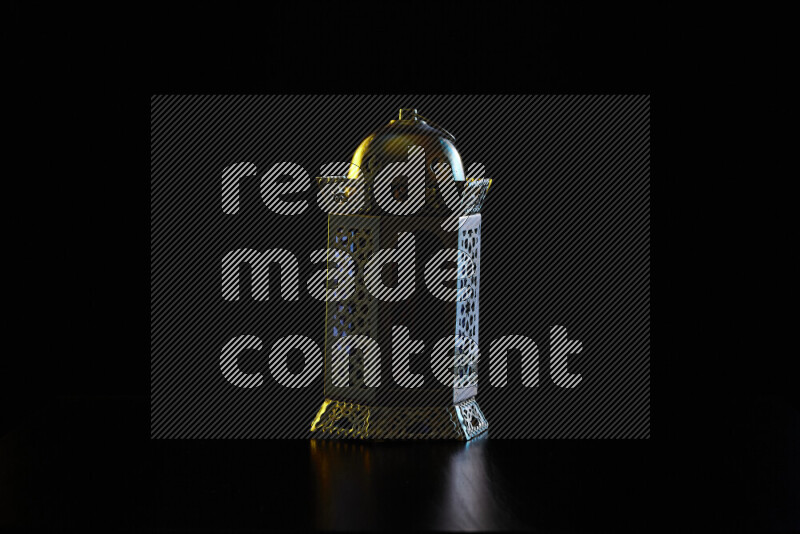 Ramadan lanterns with colored rim light against black background