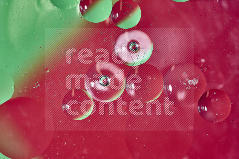 Close-ups of abstract oil bubbles on water surface in shades of green and red