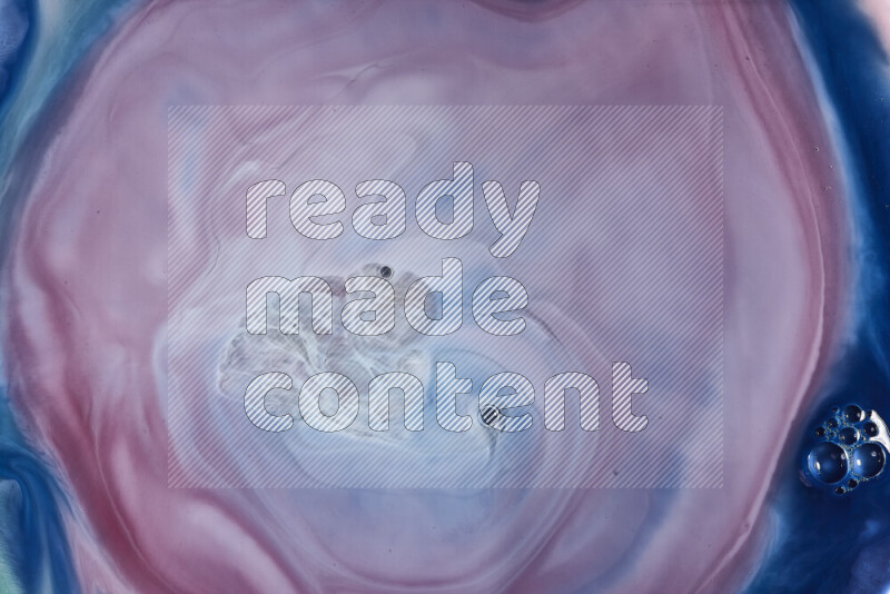 A close-up of abstract swirling patterns in blue, red and white