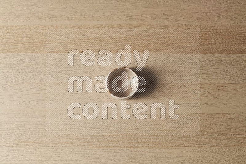 Top View Shot Of A Multicolored Pottery Bowl on Oak Wooden Flooring