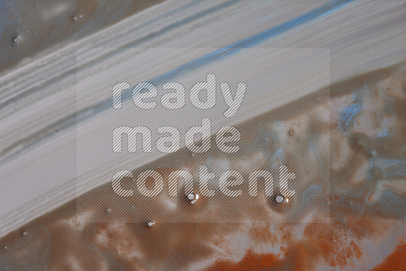 خلفية ملونة مع مزيج من ألوان الطلاء البرتقالي والأزرق