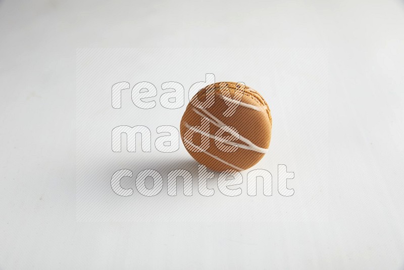 45º Shot of Brown Irish Cream macaron on white background