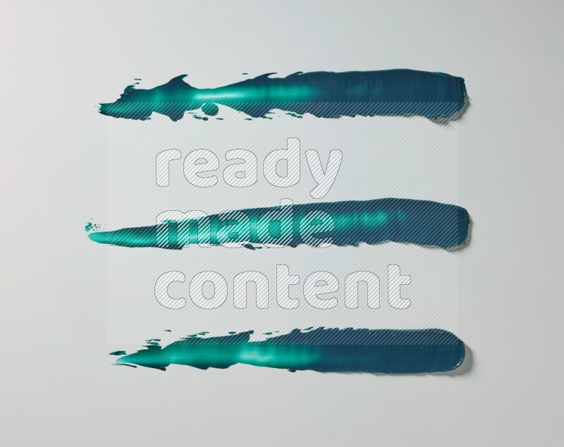 Turquoise painting knife strokes on white background