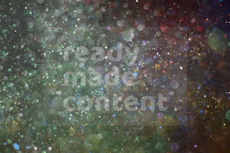 Multicolored glitter powder isolated on black background
