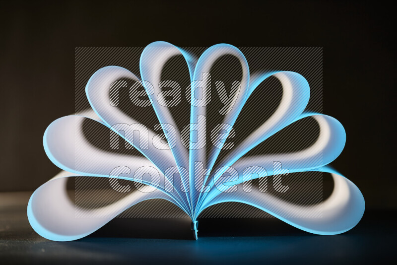 An abstract art piece displaying smooth curves in blue and white gradients created by colored light