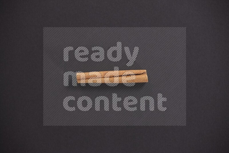 Cinnamon stick on black background