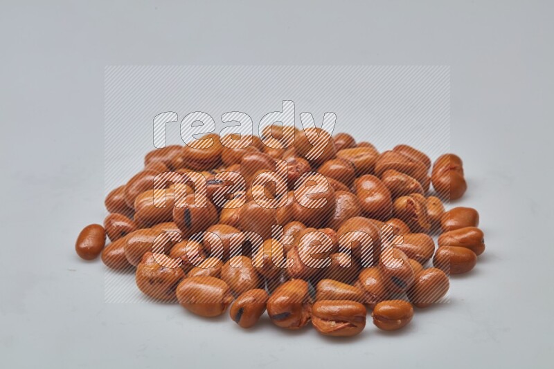 Close up shot of cooked fava beans (foul) on white background