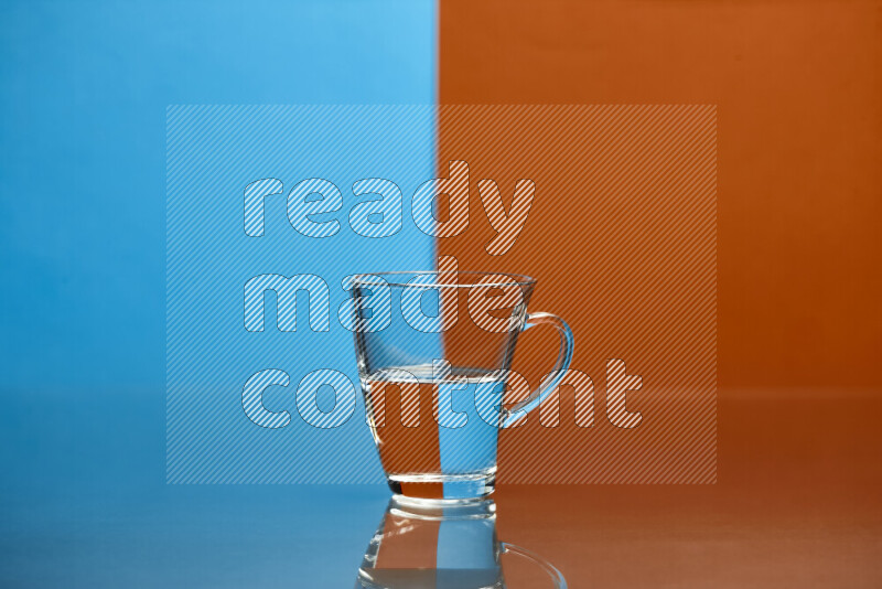 The image features a clear glassware filled with water, set against blue and dark orange background